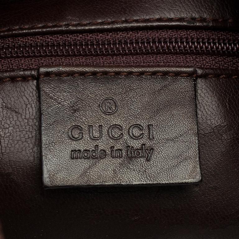 A Gucci leather bag.