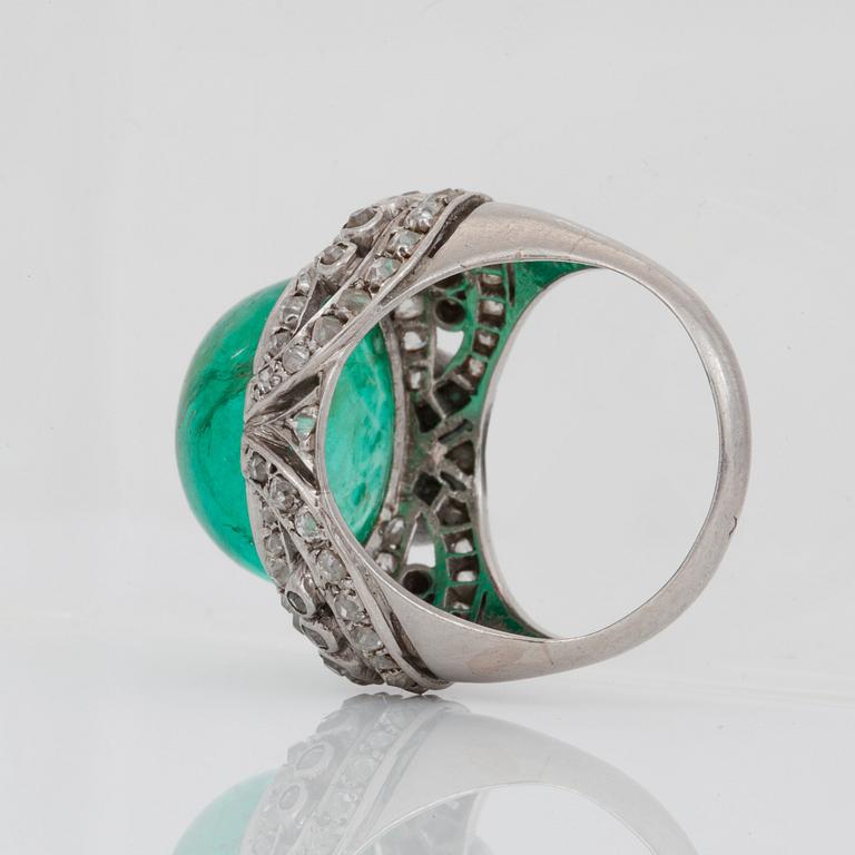 A cabochon-cut emerald and old-cut diamond ring.