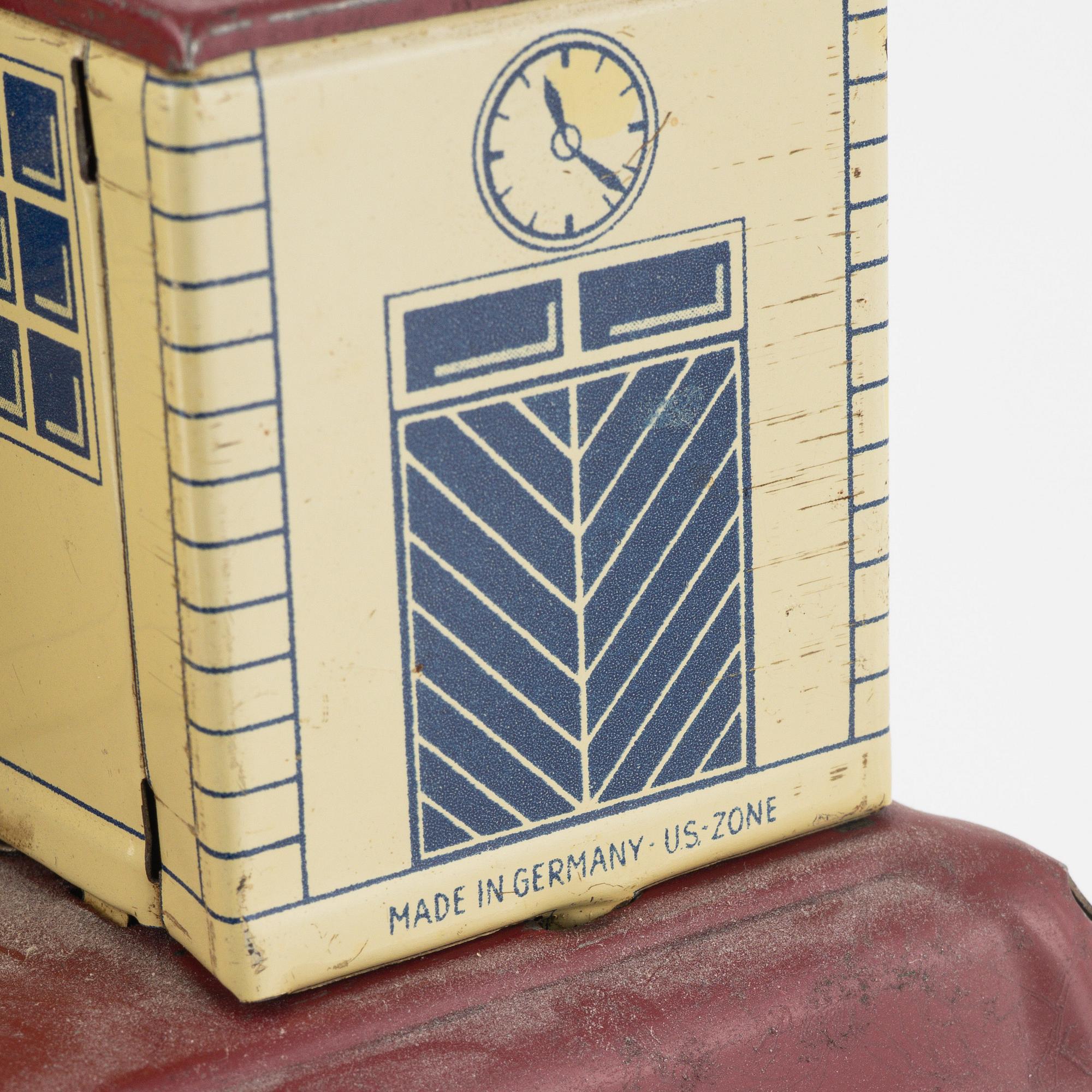 Three tin toys including a Gescha tank, Germany, mid 20th century.