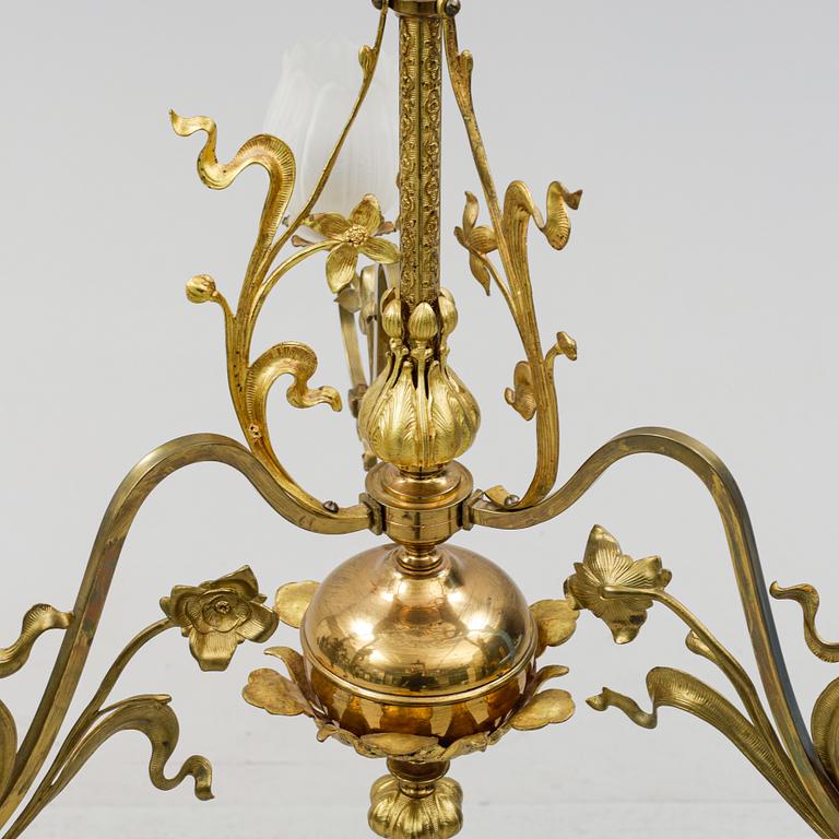 A brass art noveau ceiling lamp, early 20th Century.