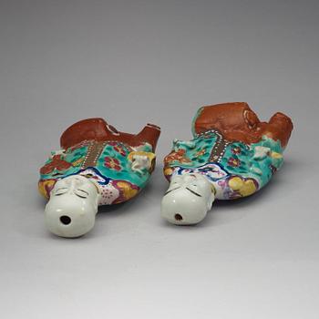 Two famille rose "laughing boys", Qing dynasty, circa 1800.
