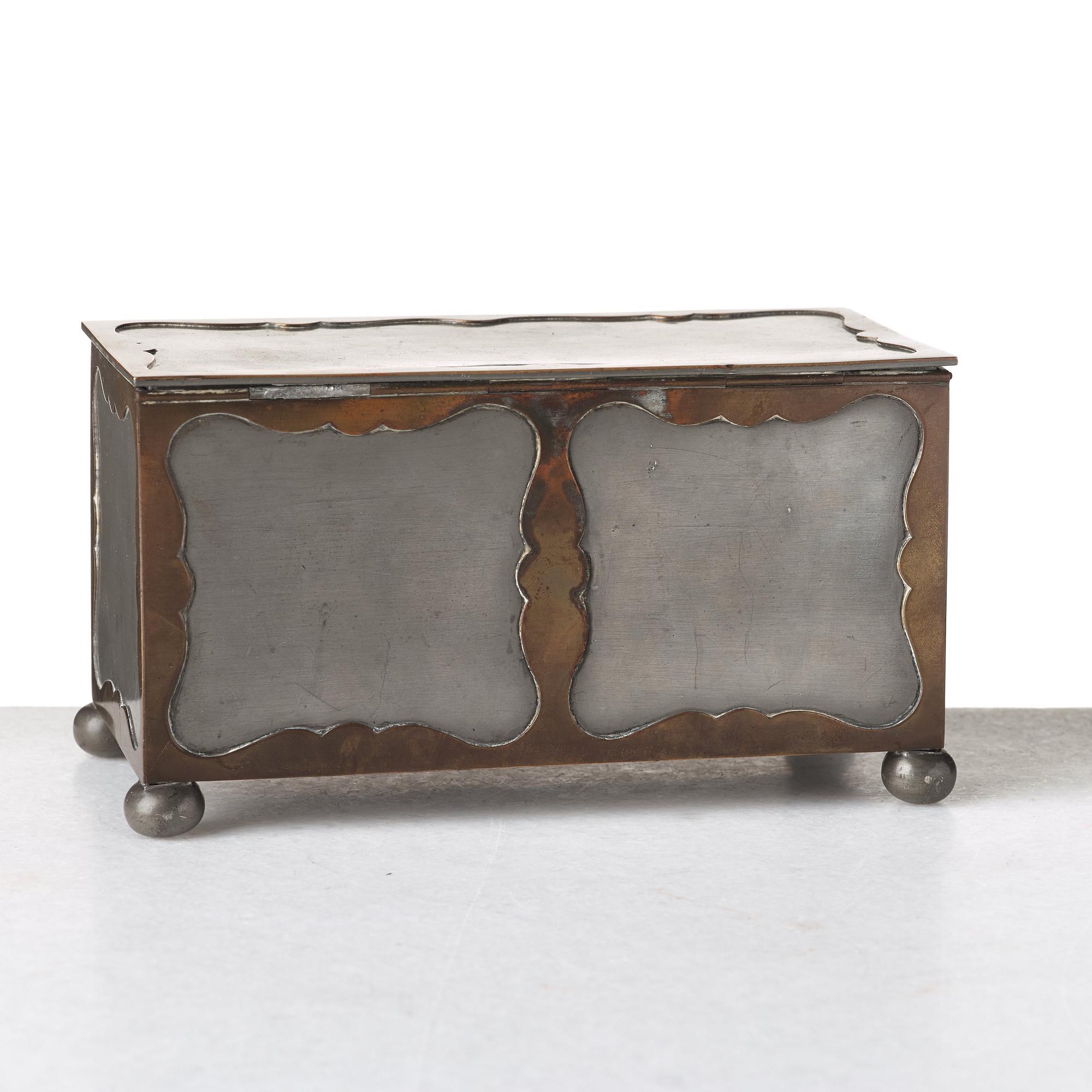 Firma Svenskt Tenn, a pewter and brass box, Stockholm 1930, model A 854.