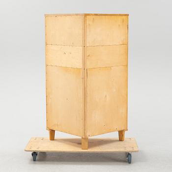 A Swedish Modern corner cabinet, 1940s.