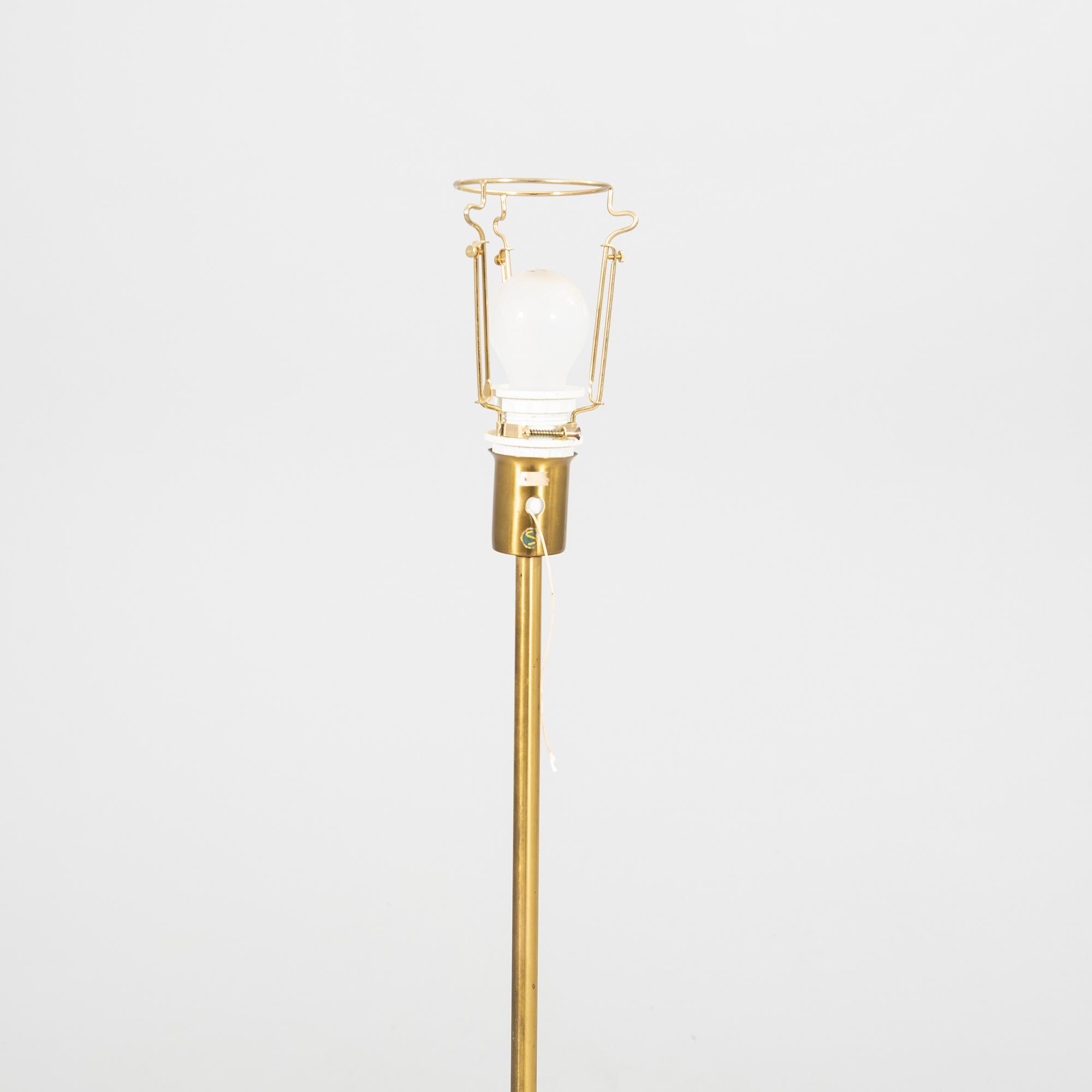 An NK 1960s brass floor lamp.