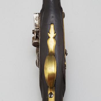 A 18th century flintlock pistol.