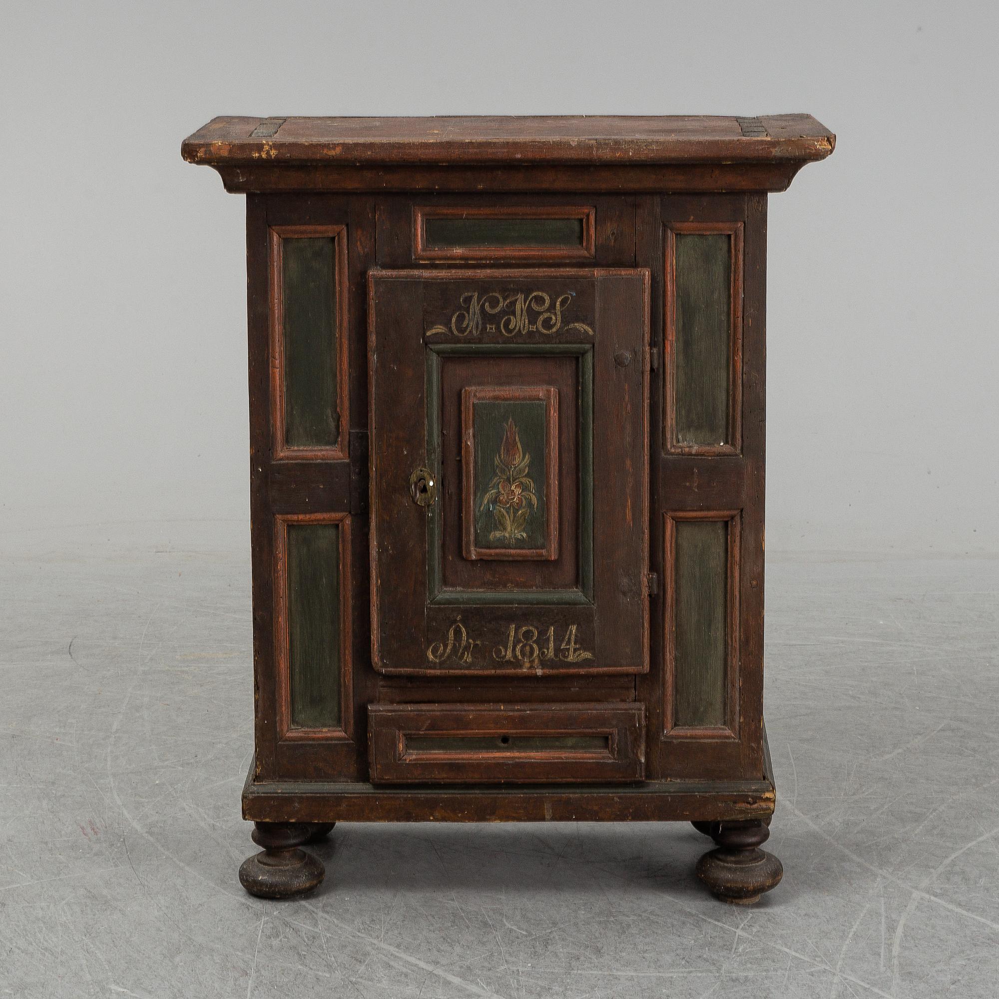 A painted cabinet, marked 1814.
