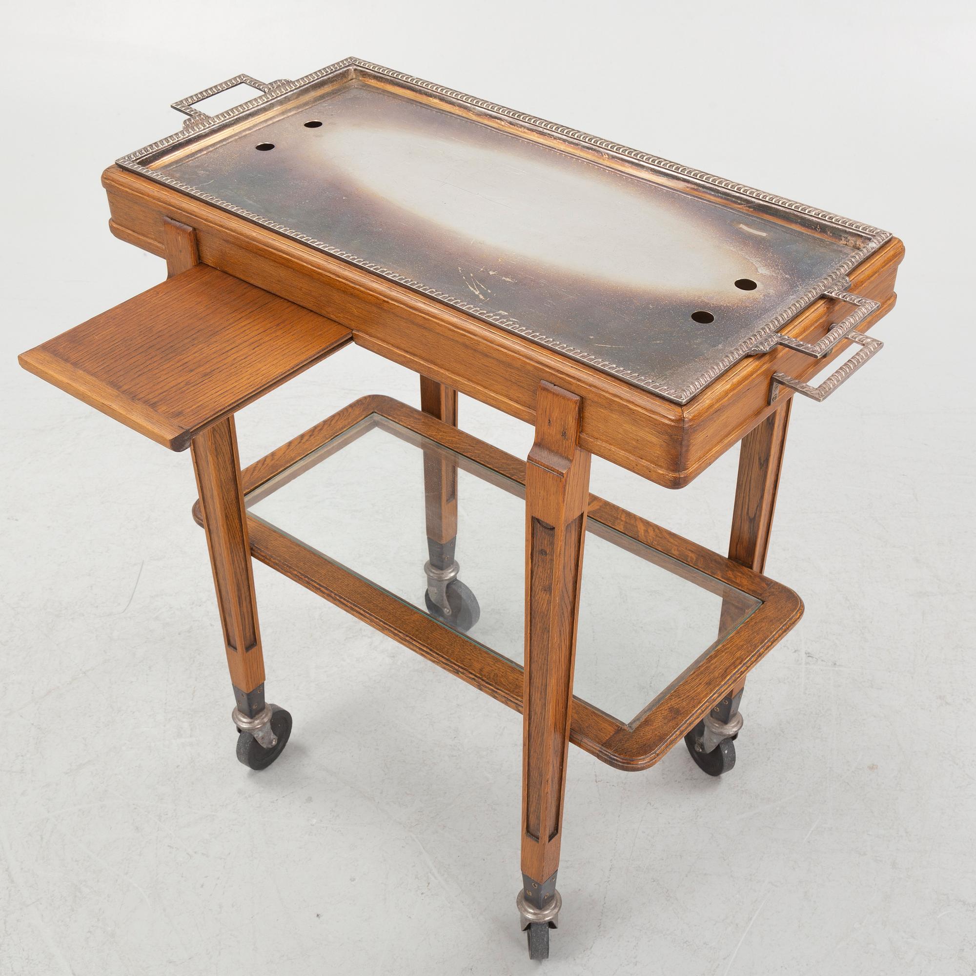 A restaurant serving trolley with silver plate dishes, first half of the/mid 20th century.