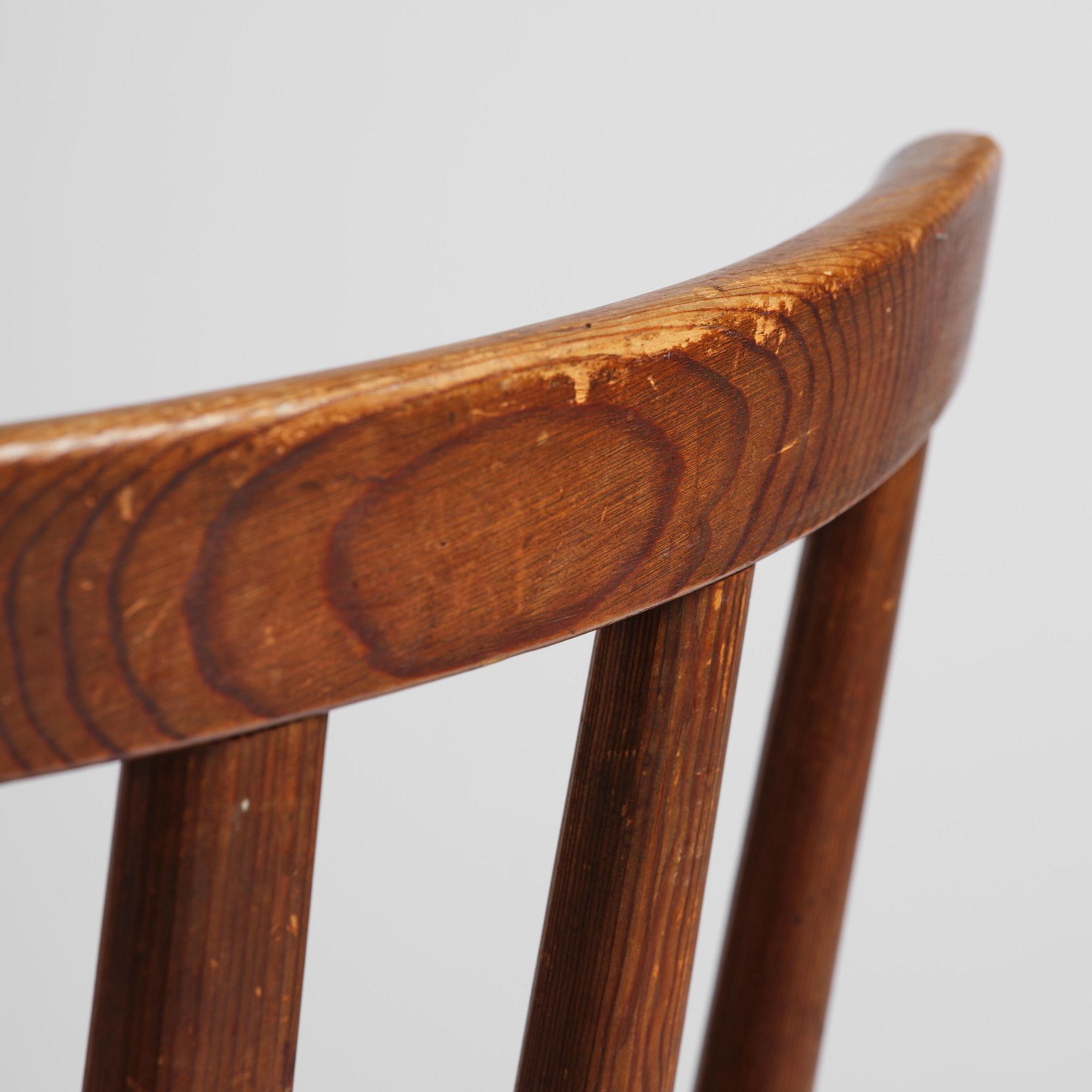 Axel Einar Hjorth, a set of three stained pine "Utö" chairs, Nordiska Kompaniet, Sweden, 1930s.