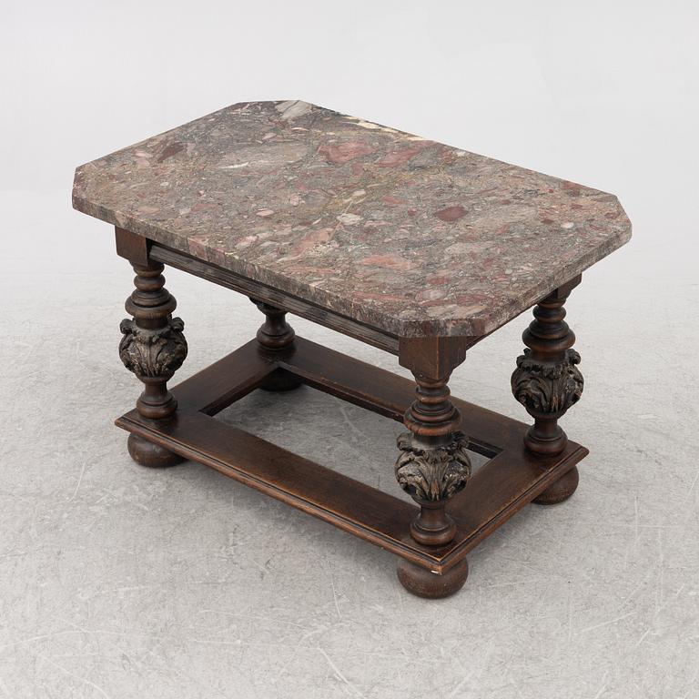 A 19th century Baroque style stone-top table.