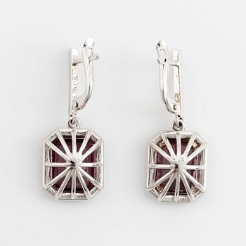 Purple tourmaline and brilliant cut diamond earrings.