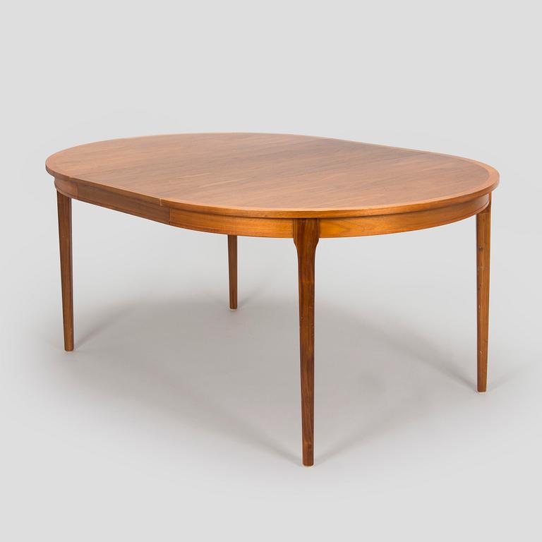 A 1960s teak and oak dining table.