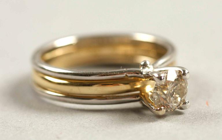 RING, 14K rödguld samt vitguld med briljant ca 0,75 ct.