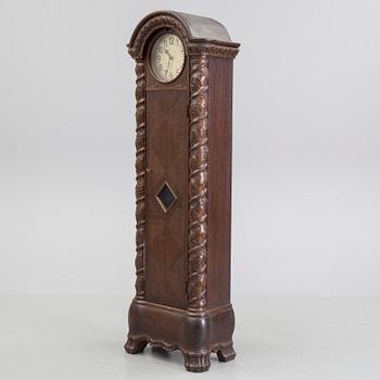 An early 20th century art nouveau grandfather clock.