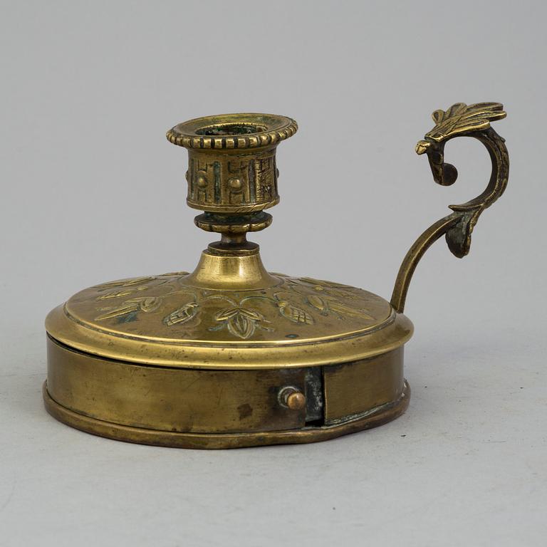 A BRASS NIGHT LIGHT HOLDER, first half of the 19th century.