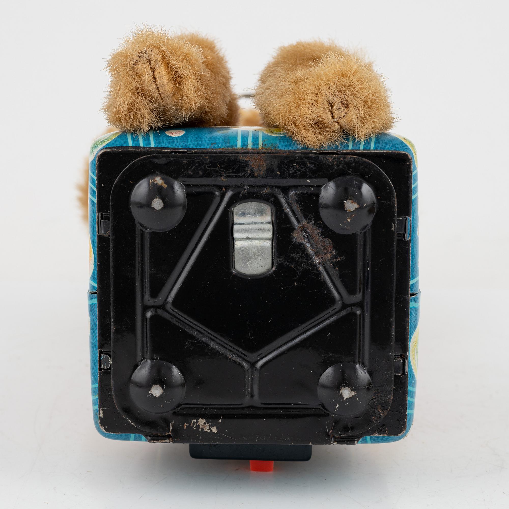 A set of five toys, including 'Rolly' clown from Schuco, 20th century.