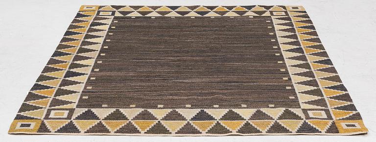 A flat weave rug, c. 245 x 185 cm.