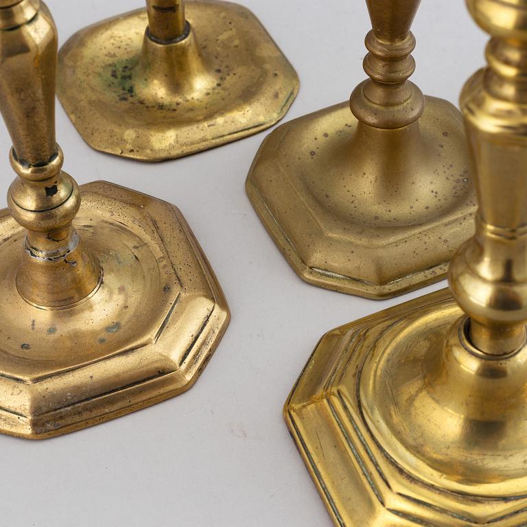 Four 18th century bronze candlesticks.