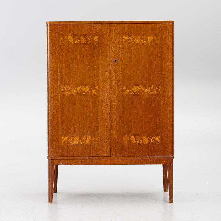 A Swedish Modern cabinet, 1940s.