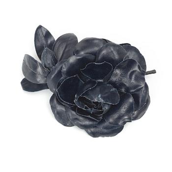 619. YVES SAINT LAURENT, a dark blue brooch.