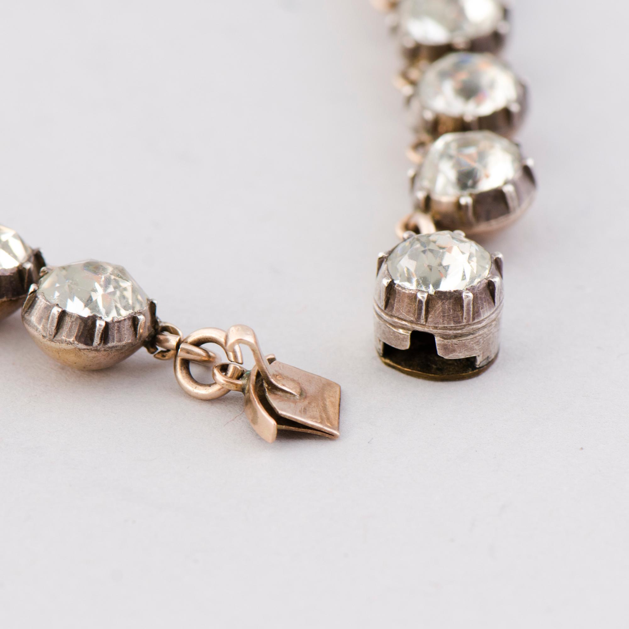 A  RIVIERE NECKLACE, facetted glass, silver, 19th century.