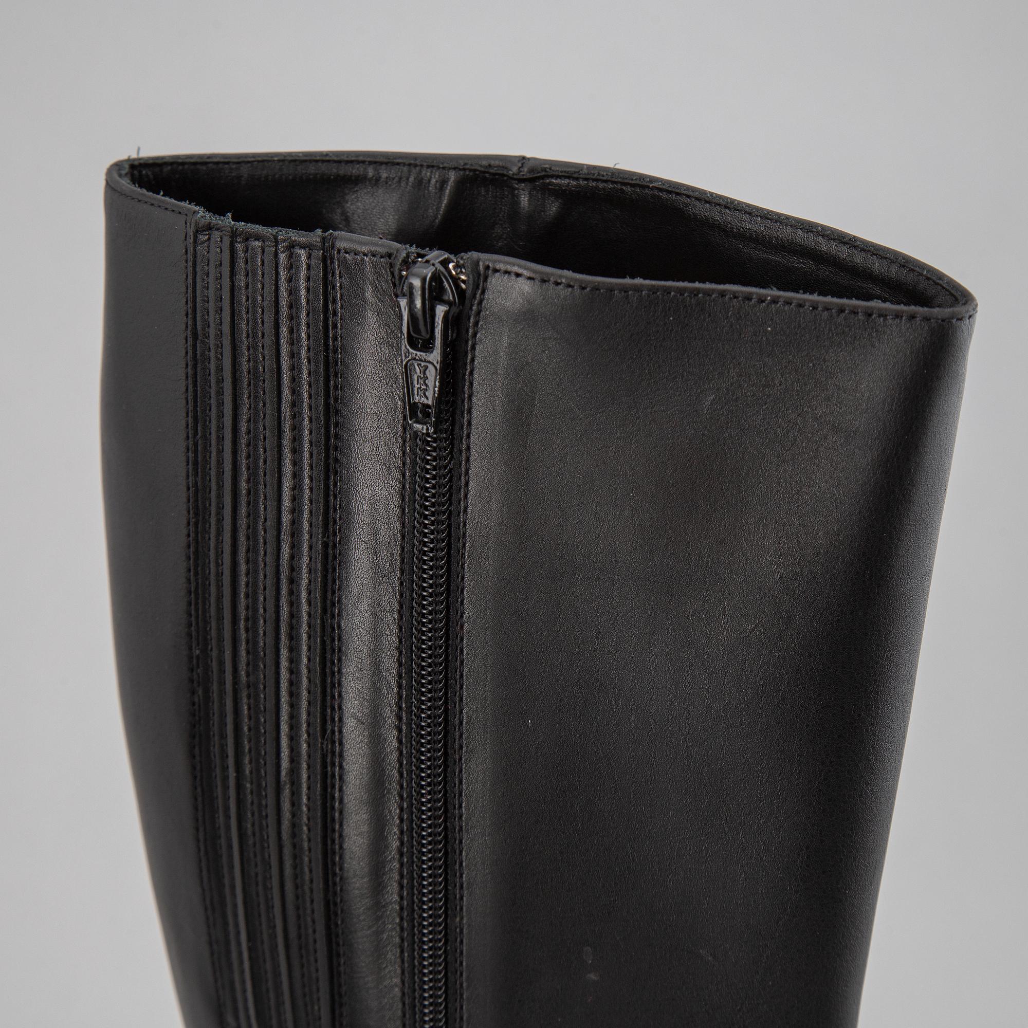 CHRISTIAN LOUBOUTIN, a pair of leather boots, size 37.