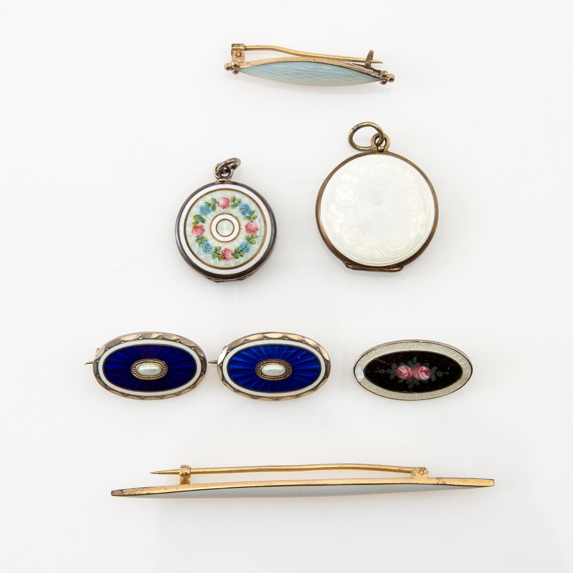 Two pendants and five brooches made of silver and enamel, including Aksel Holmsen, Norway, circa 1900.