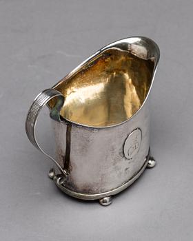 A Swedish early 19th century parcel-gilt milk-jug, mark of HI Lyberg, Borås 1820.