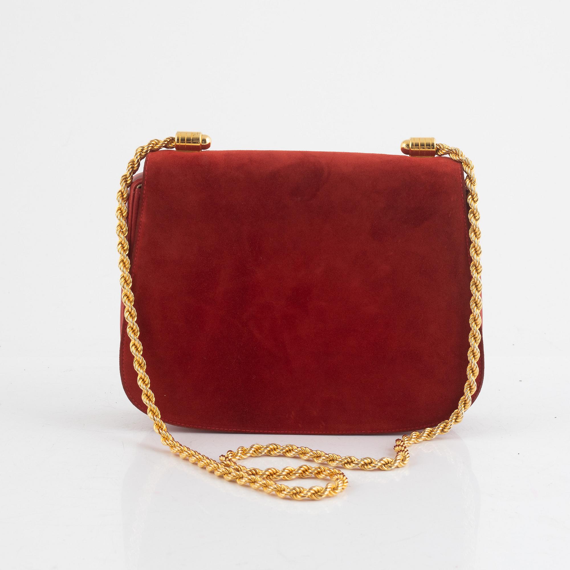 Gucci, a vintage suede bag.
