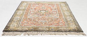 A silk Qum rug, c. 172 x 105 cm.