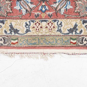 An Isfahan carpet, signed, approx. 372 x 255 cm.
