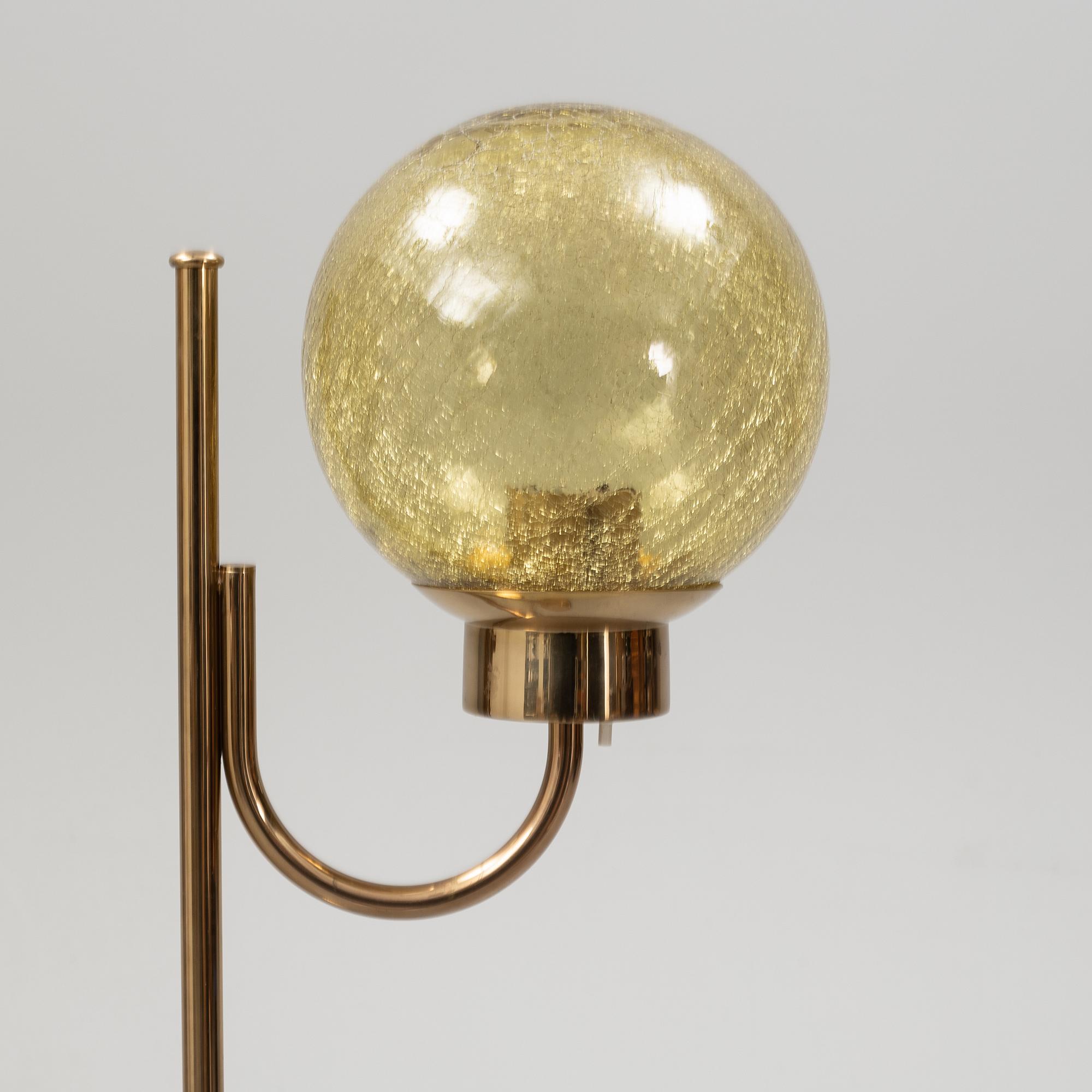 Bergboms, a pair of model 'G-118', brass and glass floor lamps. Second half of the 20th century.