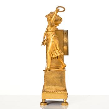 An Empire ormolu figural mantel clock, early 19th century.