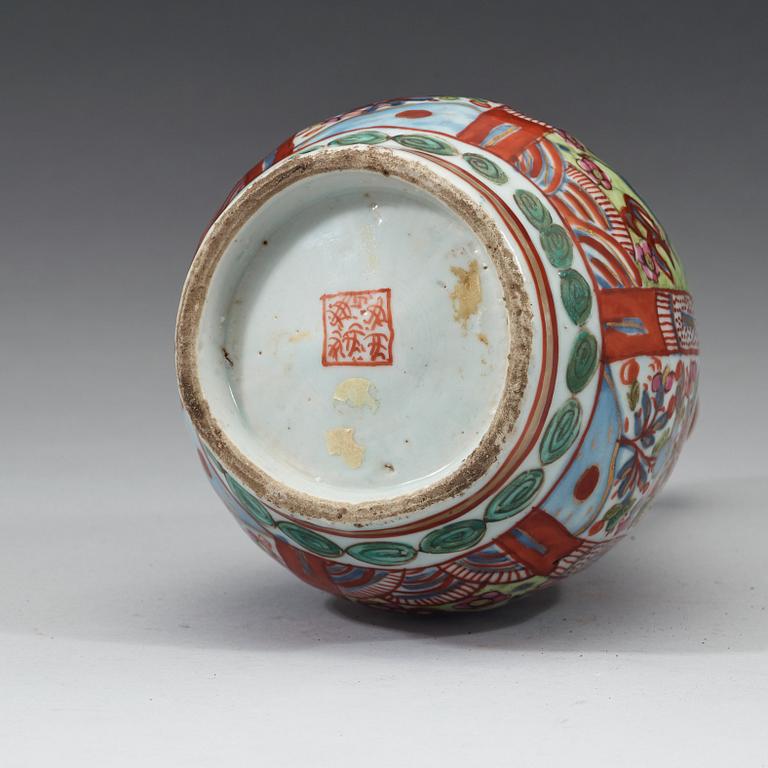 A 'clobbered' bottle vase, Ming dynasty, Wanli (1572-1620).