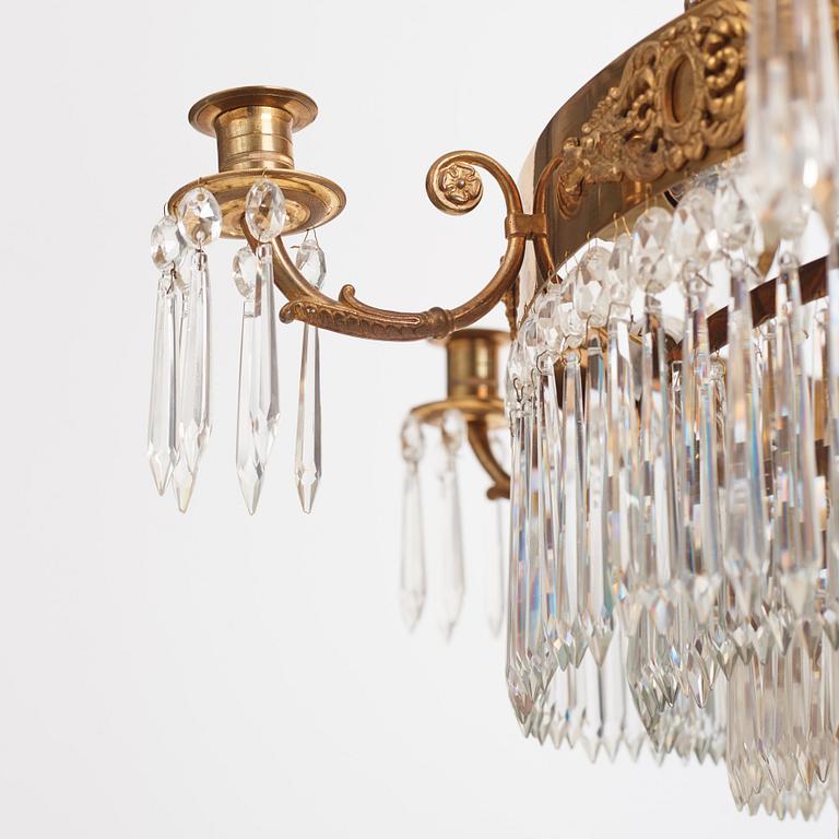 A gilt brass and cut glass nine-light Empire chandelier, first part of the 19th Century.
