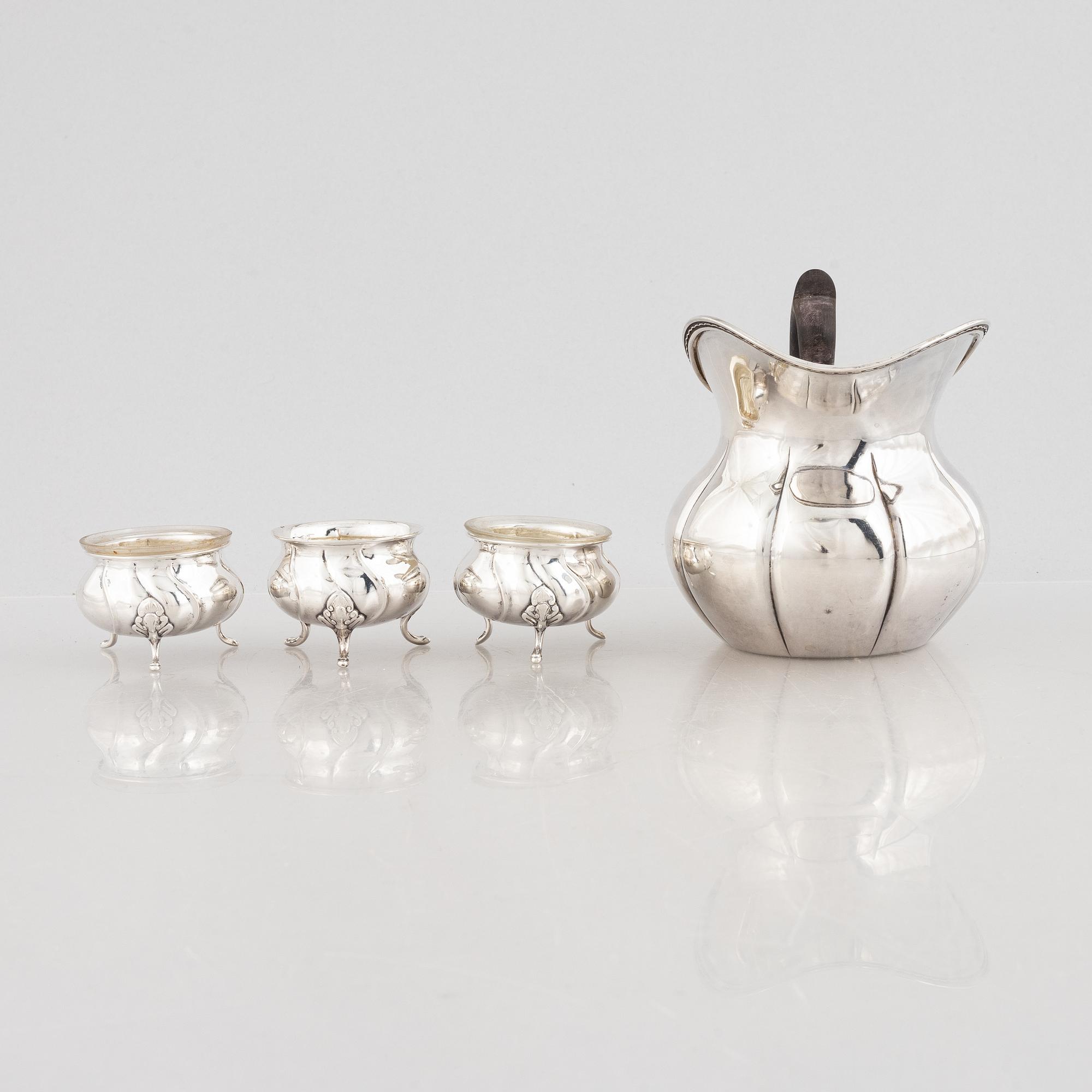 A Danish silver jug and three salt cellars, first half of the 10th Century.
