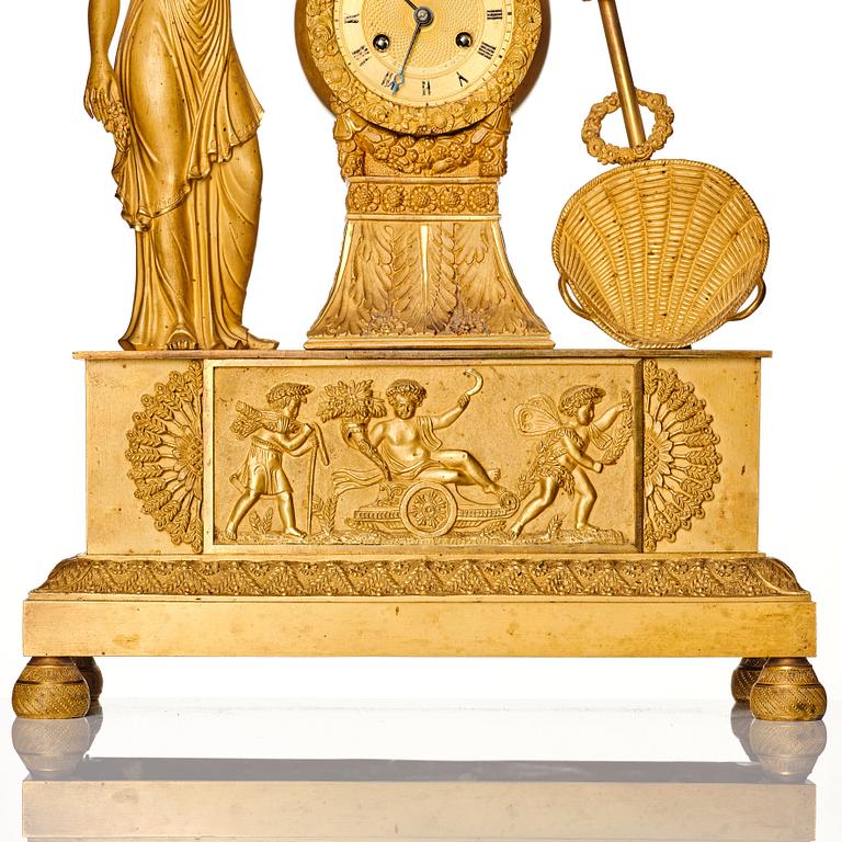 A French Empire gilt bronze mantel clock, 19th century.