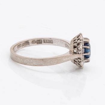 Ring 18K vitguld med 1 safir 0,77 ct och briljanter 0.23 ct enligt gravyr, Juvelia Uppsala 1991.