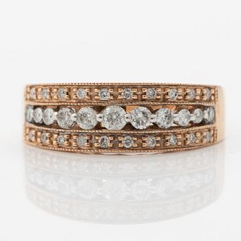 14K rose gold ring with round brilliant-cut diamonds.