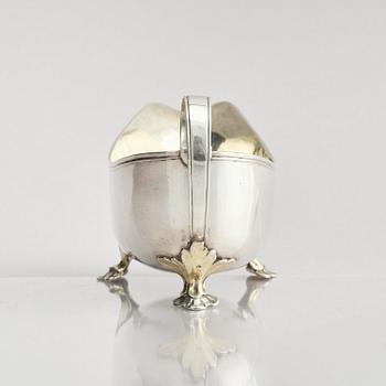 A Swedish early 19th century parcel-gilt cream-jug, mark of Johan Wasserman, Lindesberg, Sweden 1810.