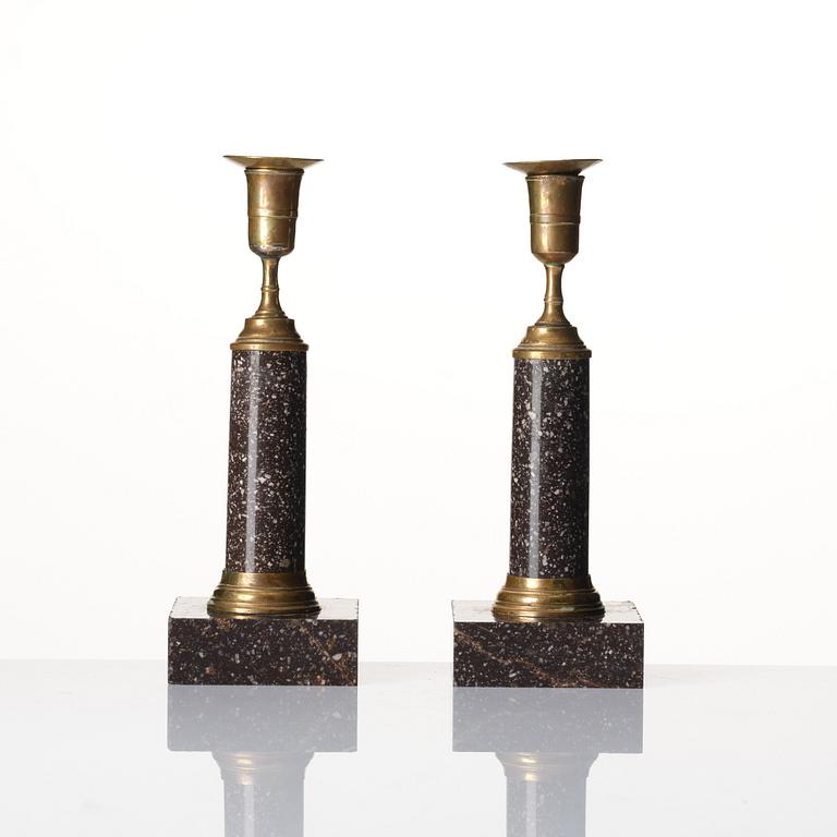 A pair of late Gustavian gilt-brass and 'Blyberg' porphyry candlesticks, Stockholm, circa 1800.