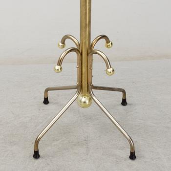 A late 20th century brass coat hanger.