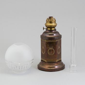 A COPPER OIL LAMP, ca 1900.