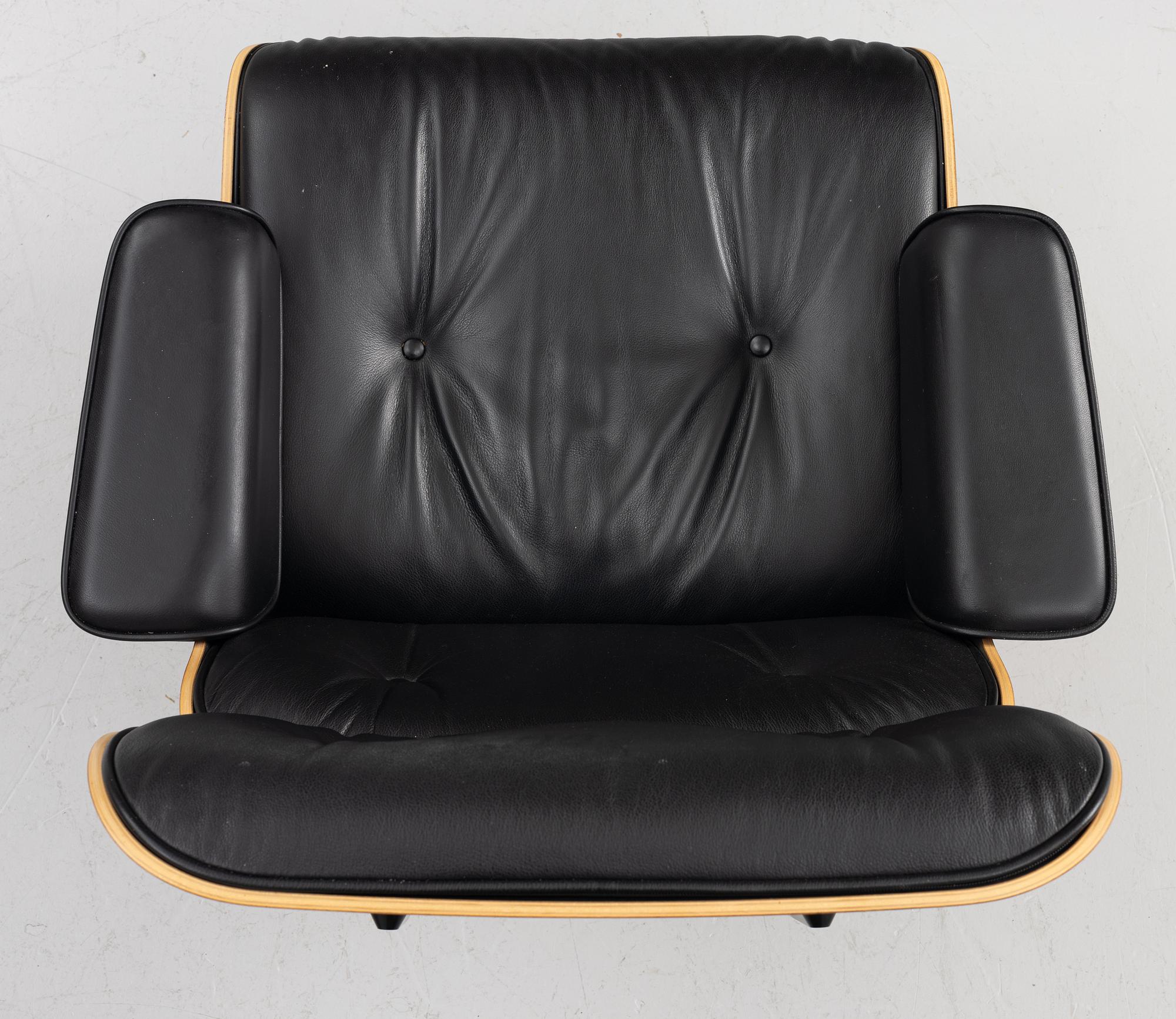 Charles & Ray Eames, Armchair with ottoman, "Lounge chair", Vitra, 21st century.
