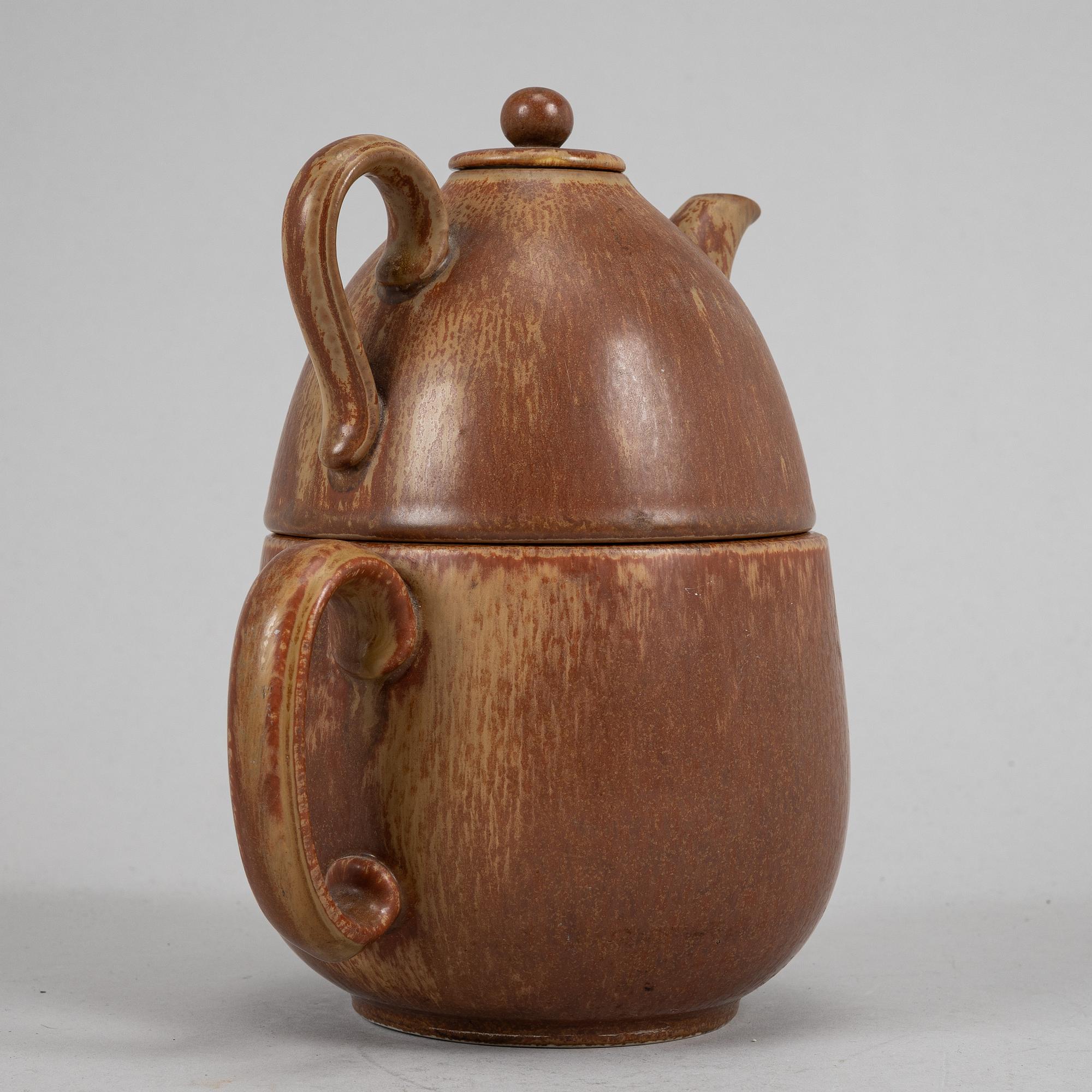Tea pot, two bowls, two creamers, and a vase by Gunnar Nylund, stoneware, Rörstrand.