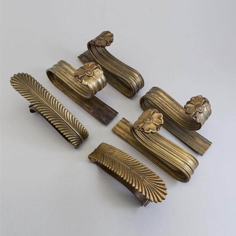 SIX BRONZE CURTAIN TIE-BACKS (4+2), 19th century.