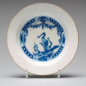 A set of eight blue and white armorial soup dishes, Qing dynasty, 18th Century.