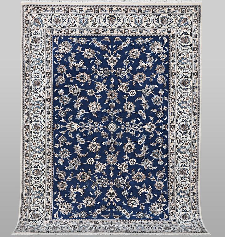 A carpet, Nain, part silk, ca 297 x 194 cm.