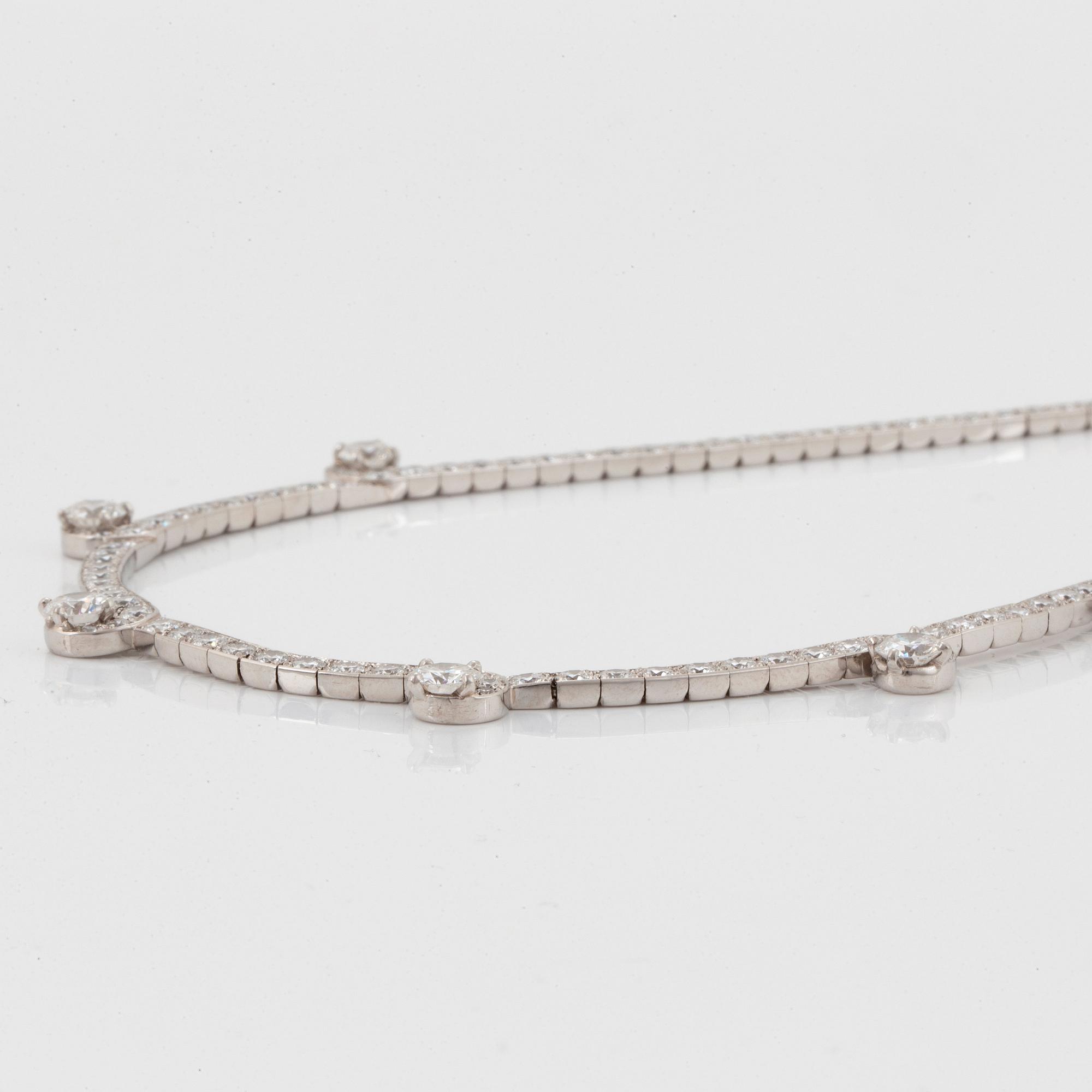 A Cartier necklace in platinum and 18K gold set with round brilliant-cut diamonds.
