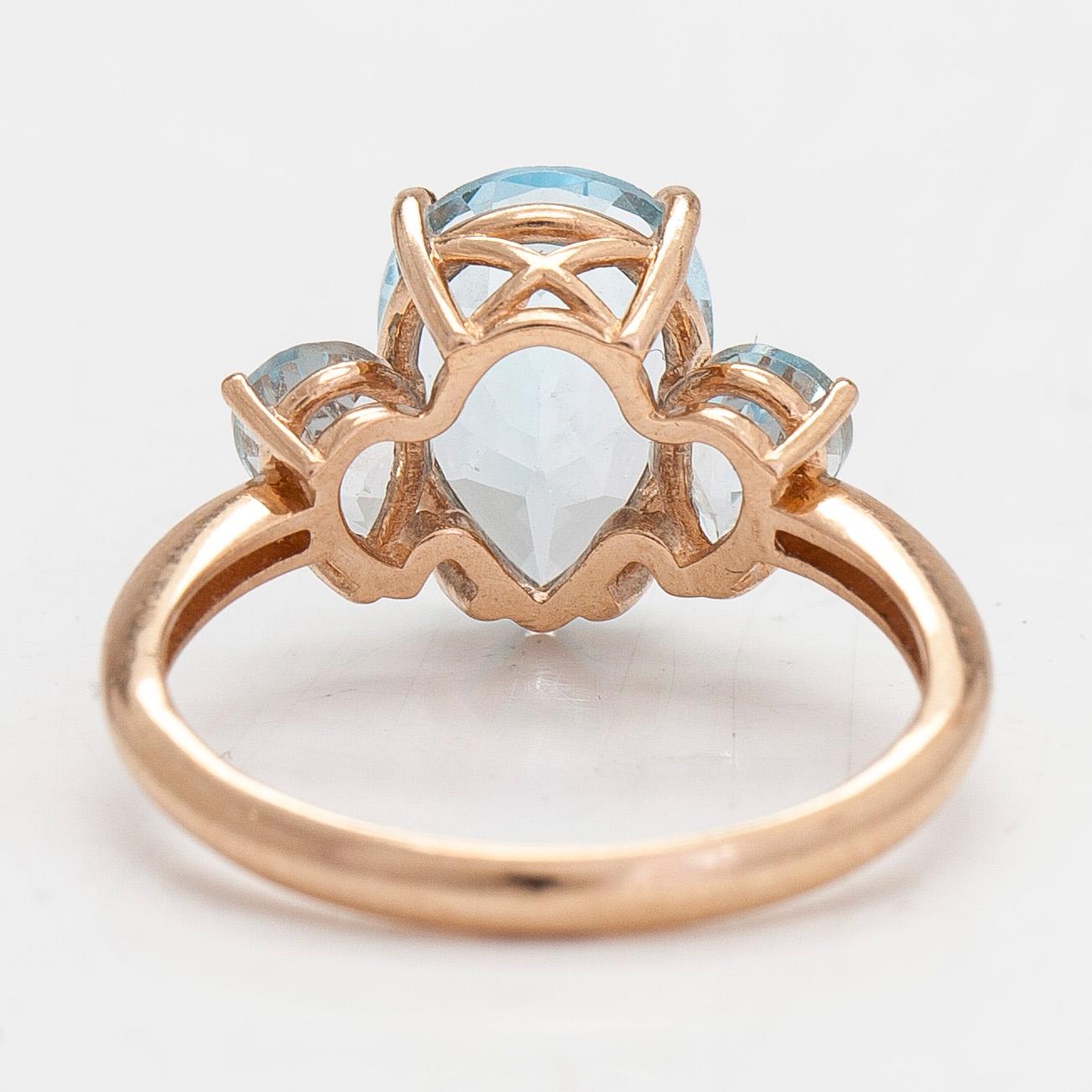 A 14K gold ring with topazes, Russia 2000-tal.