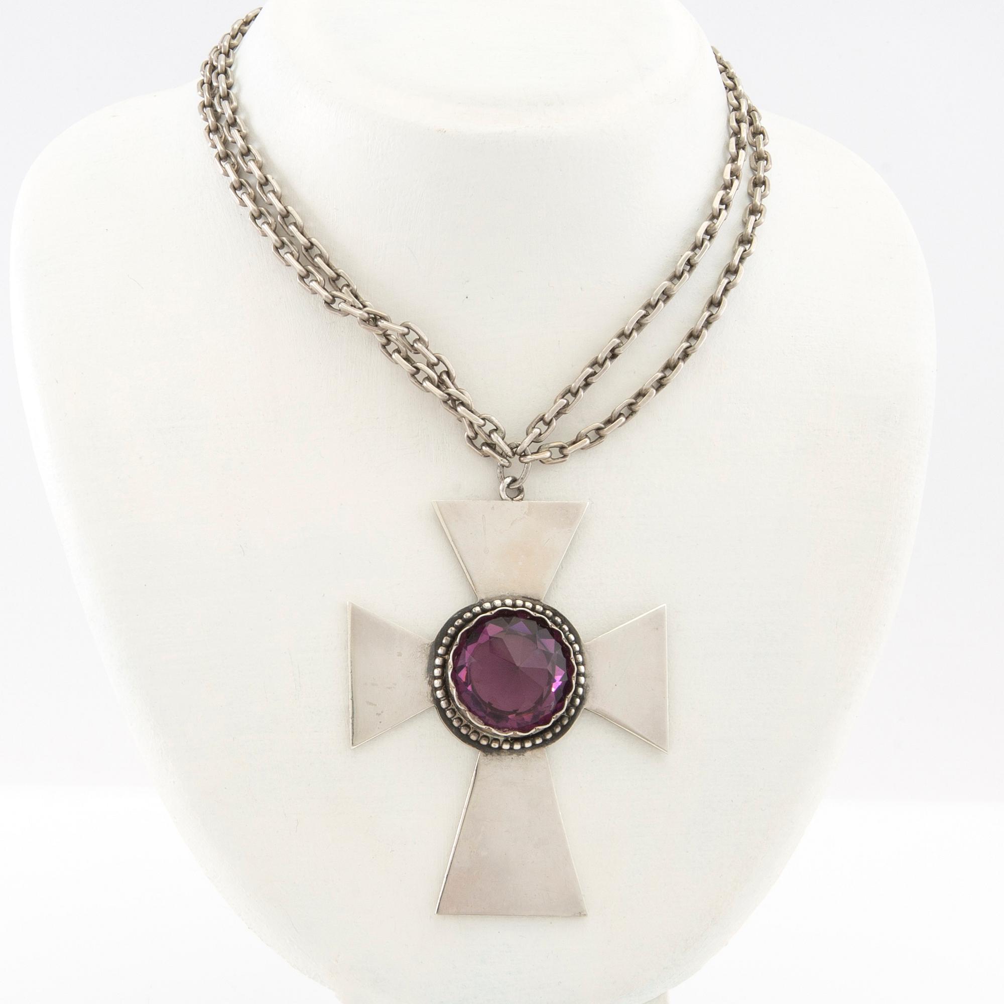 Necklace of silver in the form of a cross with faceted glass.